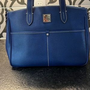 Gorgeous blue bag with handles and a shoulder strap.